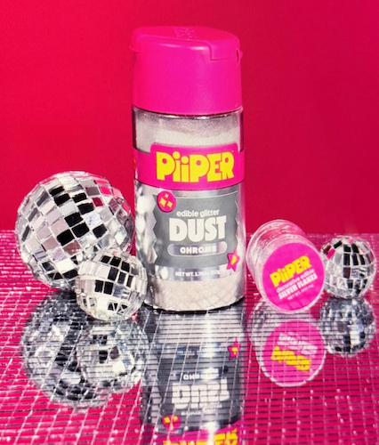 Front view of PiiPER real silver edible flakes jar with bright pink packaging and reflective silver décor on a mirrored pink background