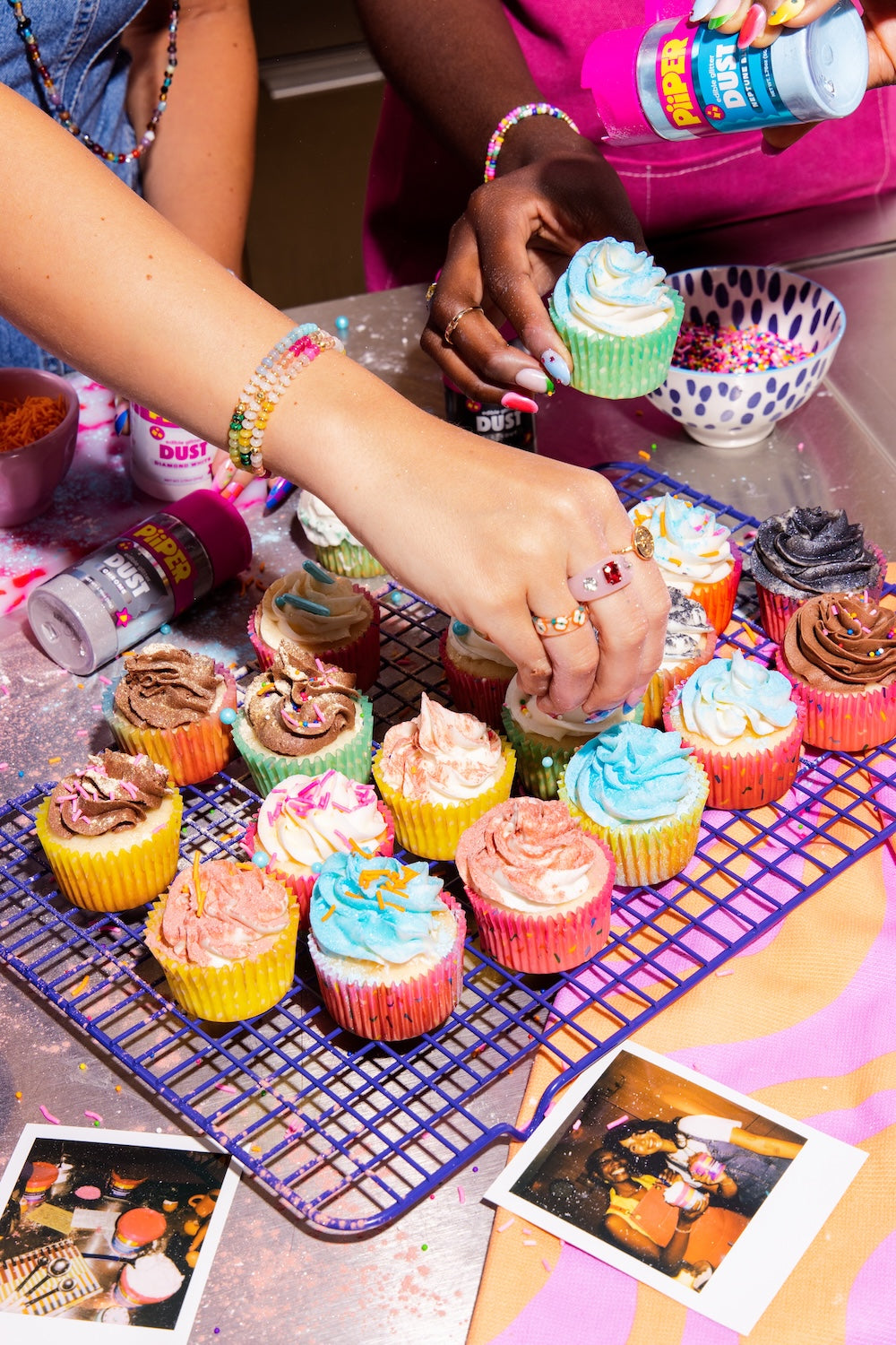 People decorate colorful cupcakes with decorative flakes and sprinkles in a vibrant kitchen
