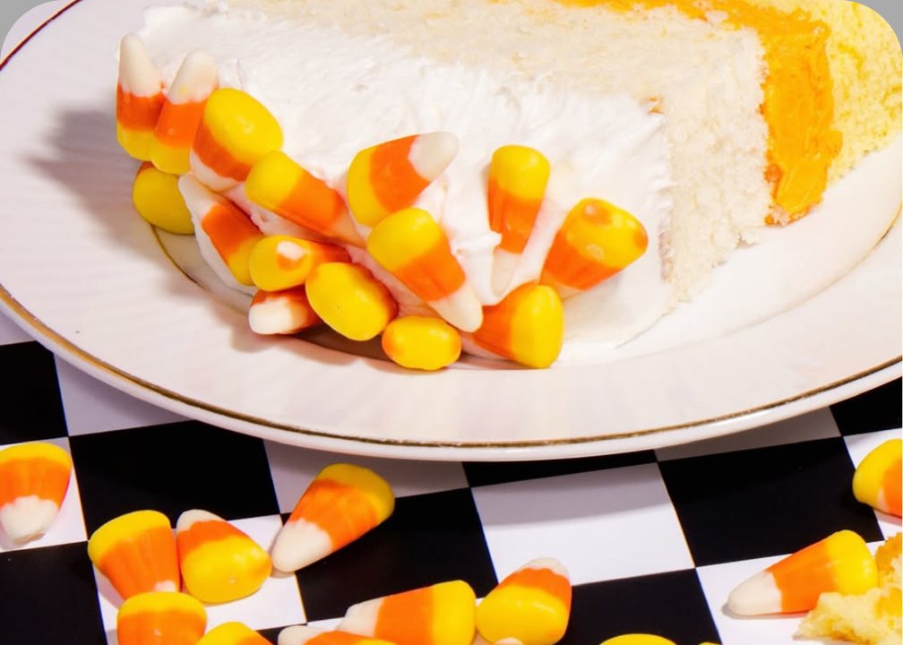 Layer cake frosted with PiiPER candy corn buttercream frosting