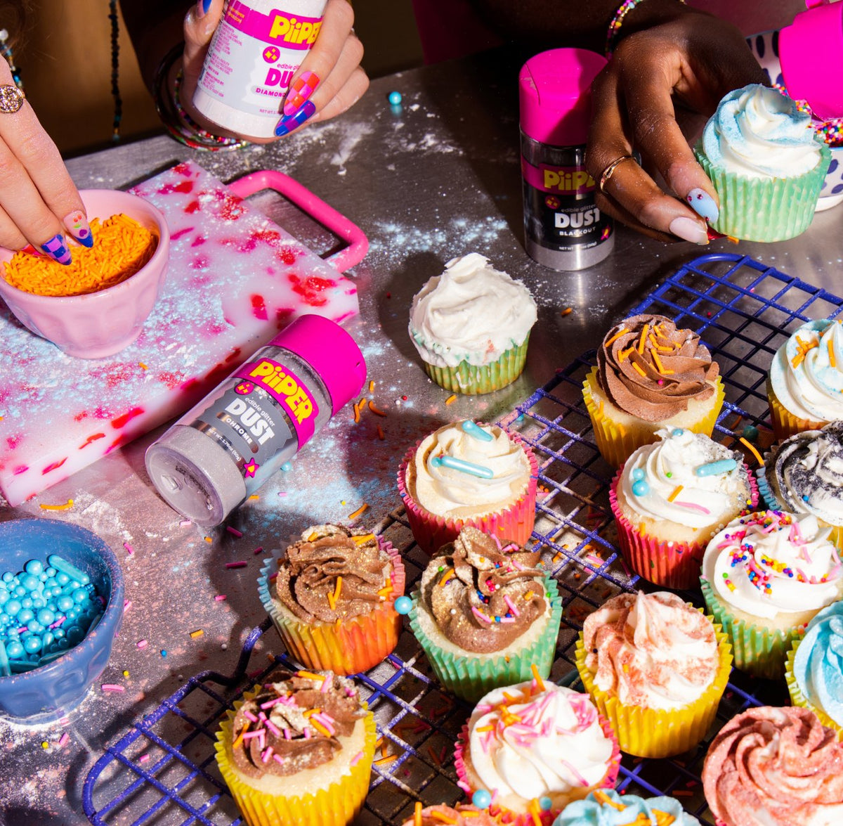 Cupcakes being decorated with PiiPER sprinkles, glitter dust and color spray