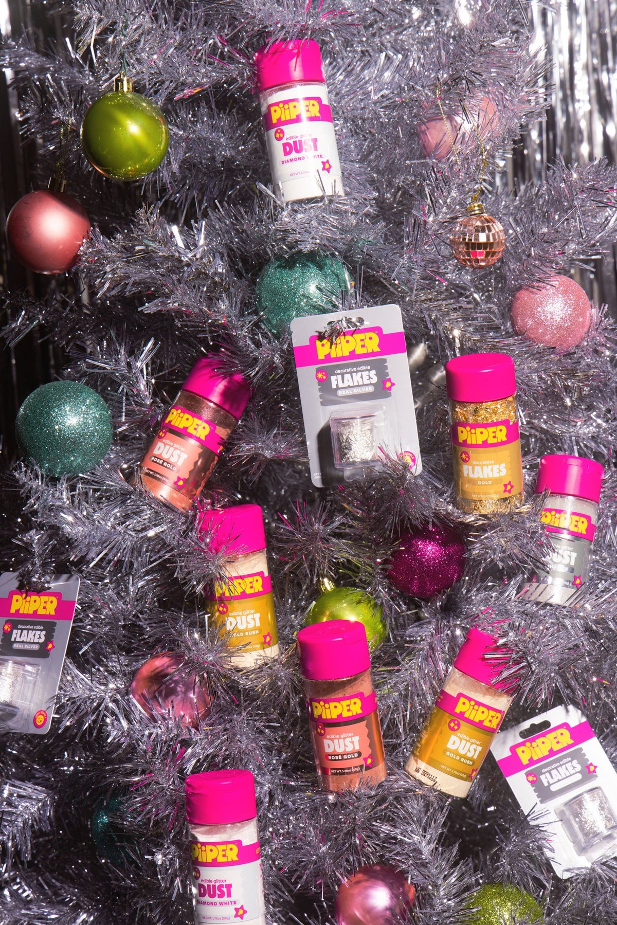PiiPER products hanging on a silver holiday tree